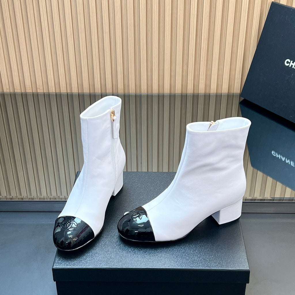 CHANEL 25S BOOTS WITH PATENT TOE CAP 50MM IN WHITE AND BLACK CALFSKIN